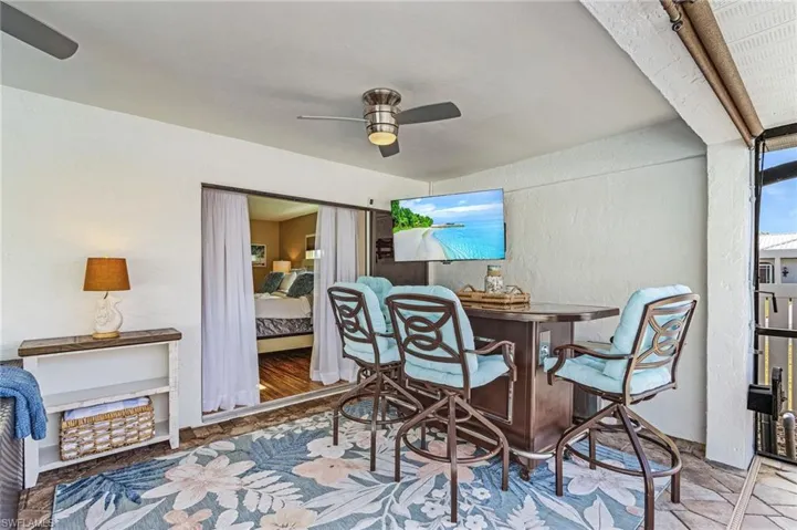 Dining area featuring wood-type flooring and ceiling fan