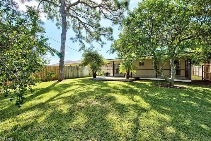 View of yard featuring a fenced backyard and a patio area