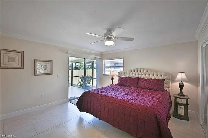 Bedroom with crown molding, access to outside, baseboards, and ceiling fan