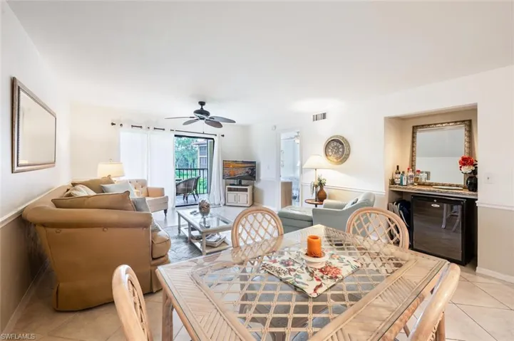 Dining room featuring light tile patterned floors and ceiling fan