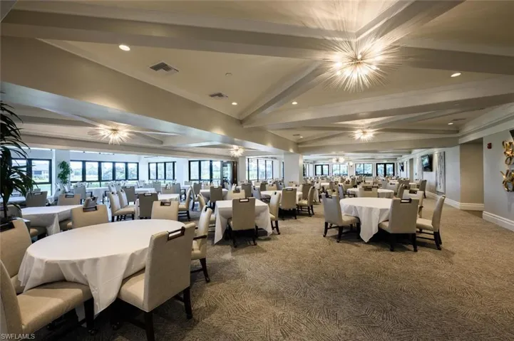 Dining room featuring beam ceiling, carpet flooring, recessed lighting, and a chandelier