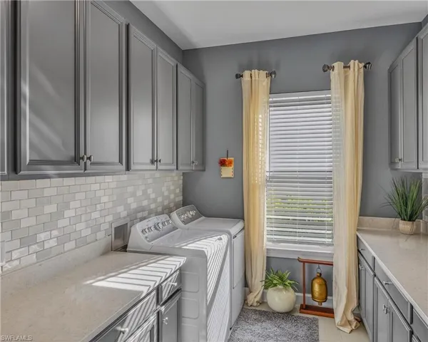 Living area featuring ornamental molding, wood finished floors, and ceiling fan