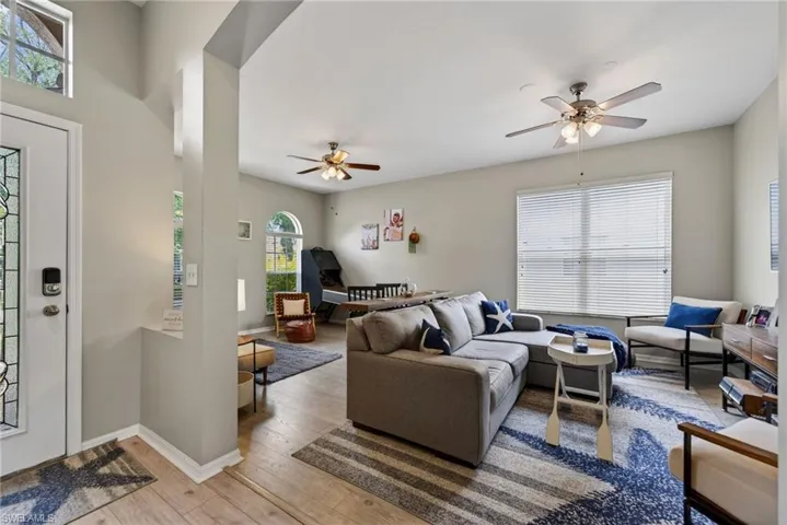 Living area featuring hardwood / wood-style flooring and ceiling fan