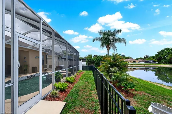 Balcony featuring a sunroom and a water view
