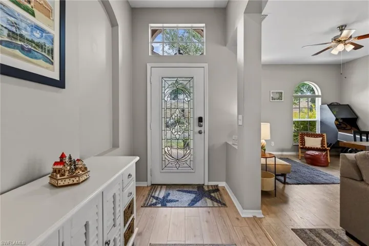 Foyer featuring light wood-style flooring and a ceiling fan