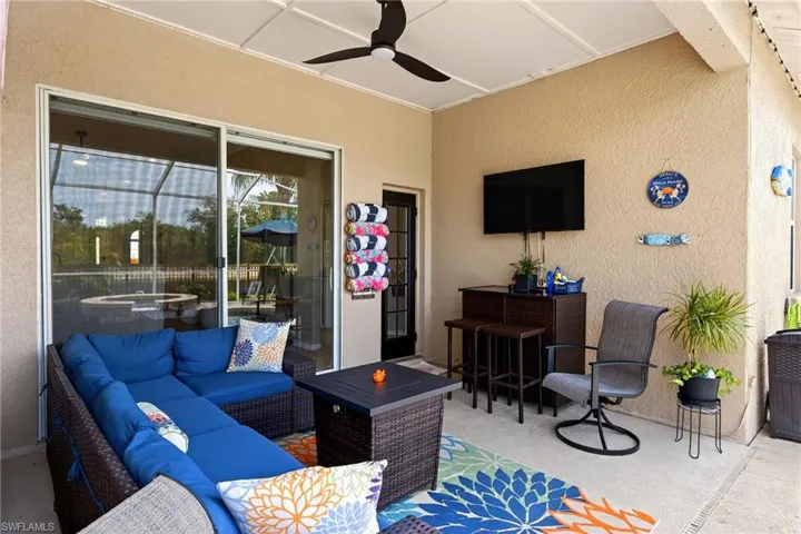 View of patio / terrace with an outdoor living space with a fire pit and a ceiling fan