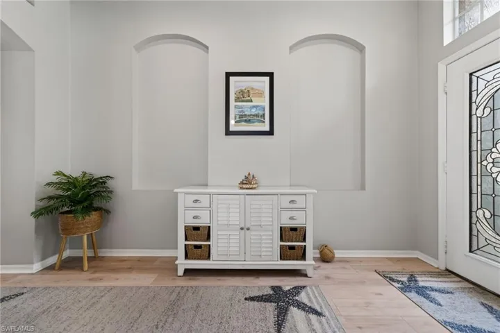 Entrance foyer featuring light wood finished floors