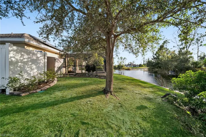 Right side of rear yard view with shade tree and Intersecting Water View