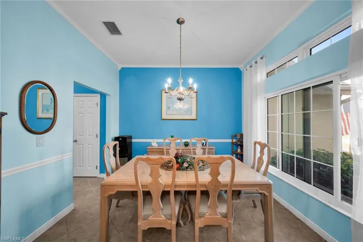 Dining area featuring crown molding, Leads into Kitchen and Great Room, New Hurricane resistant windows