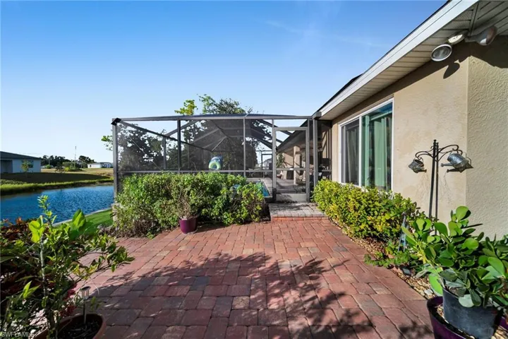 View of Screened Lanai-Pool / Brick Paver Terrace and Freshwater Canal