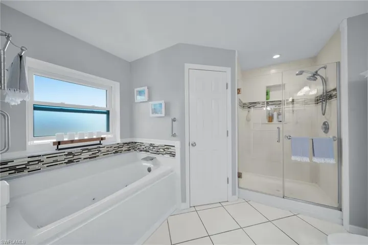 Master Bathroom, Garden Tub, Glass Enclosed Shower, Toilet Closet, Double Vanity, New Hurricane Resistant Window