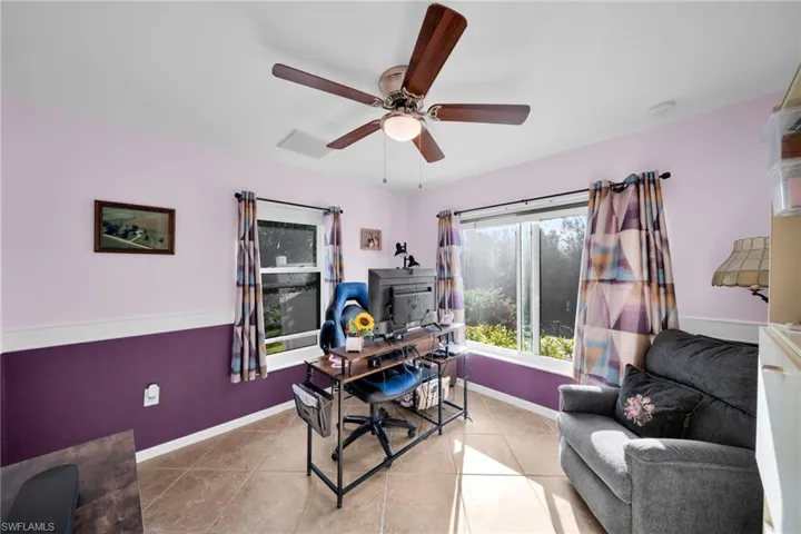 Guest Suite #1 with lots of light, Door to Pool and Screened Lanai