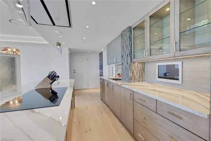 Wet Bar with wine refrigerator, ice maker and shelving