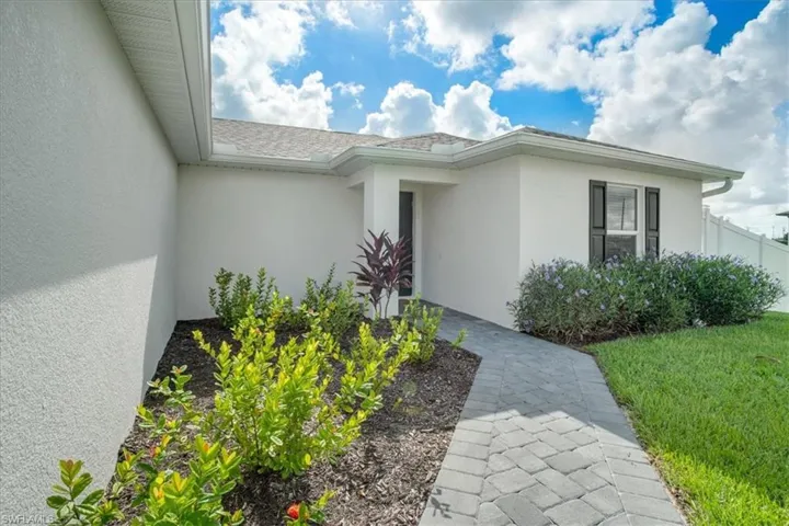 Property entrance with a lawn