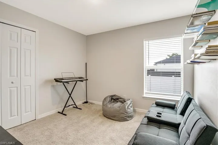 Living area with light carpet