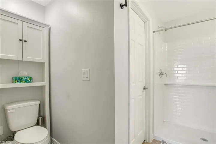 Bathroom with a shower and toilet