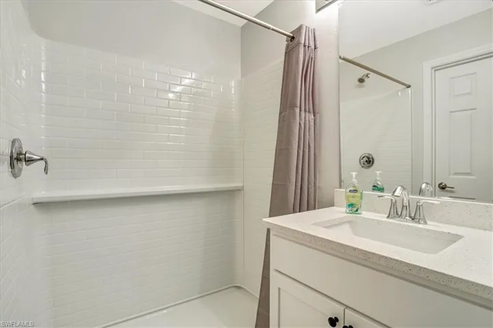 Bathroom featuring vanity and walk in shower