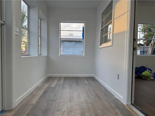 Spare room with light wood-type flooring and plenty of natural light