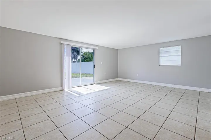 Spare room featuring light tile floors