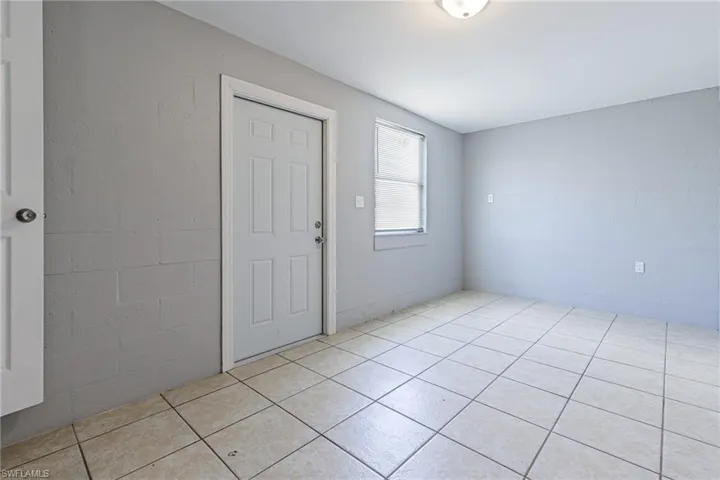 Spare room with light tile floors