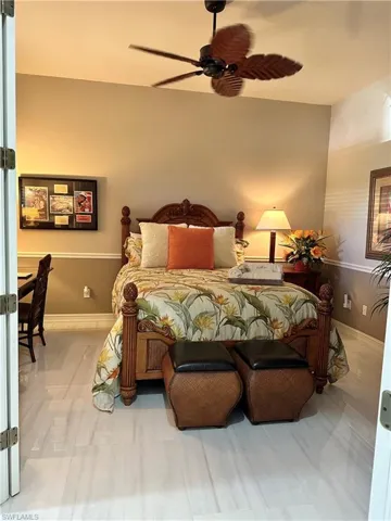 Tiled bedroom with ceiling fan
