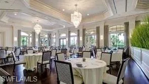 Dining room featuring an inviting chandelier and a tray ceiling