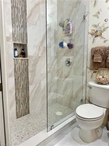 Bathroom with walk in shower and toilet