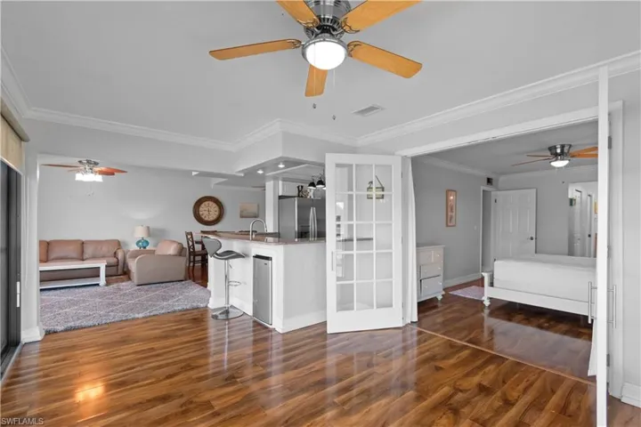 Beverage fridge located in the breakfast bar, French doors lead to your primary bedroom