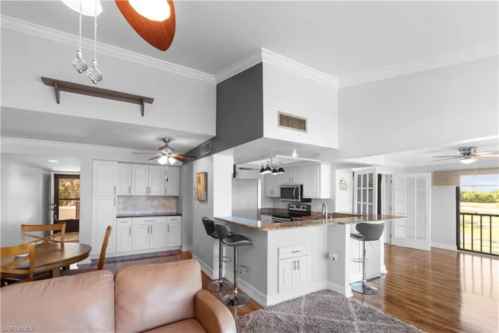Dry bar and additional beverage fridge under the breakfast bar