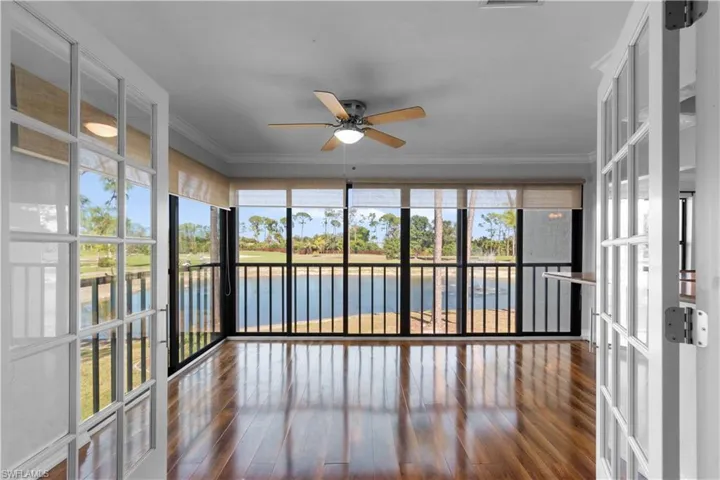 French doors from your primary bedroom lead to a cozy sun room