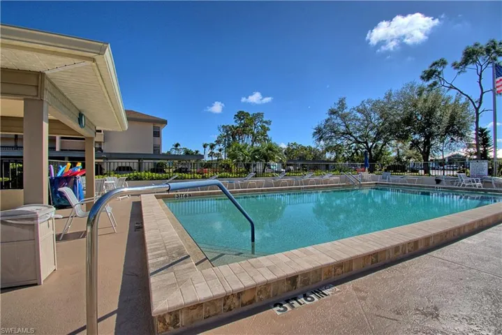 Community pool featuring a patio area