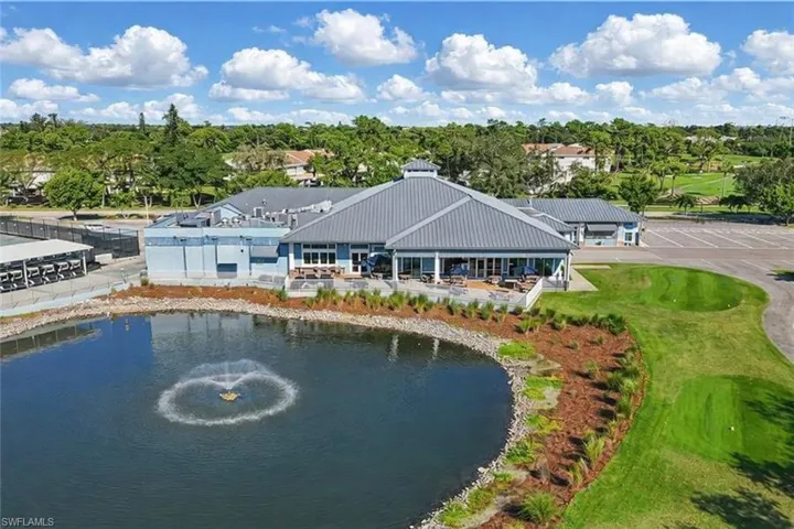 Back of the country club with large patio area and firepits
