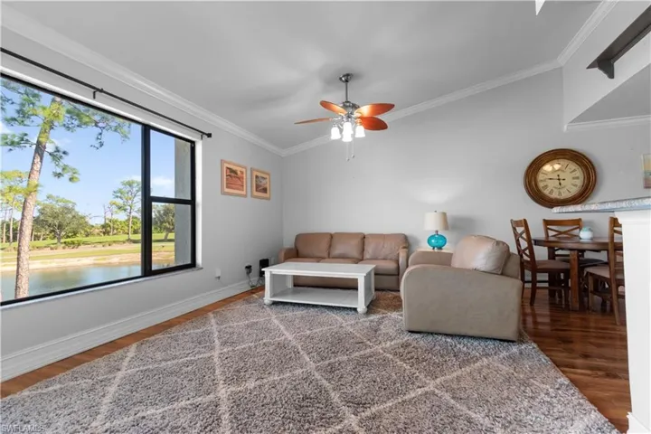 Your living room features plenty of nautural light, vaulted ceilings and crown molding