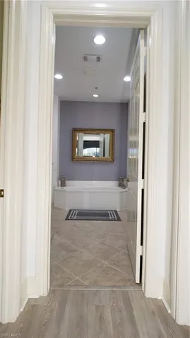 Hall to walk in closets and Master Bath