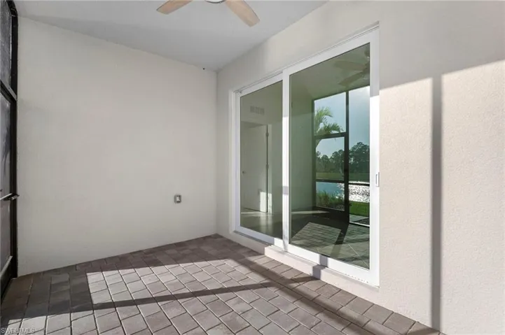 Slider doors out to the front lanai from the kitchen