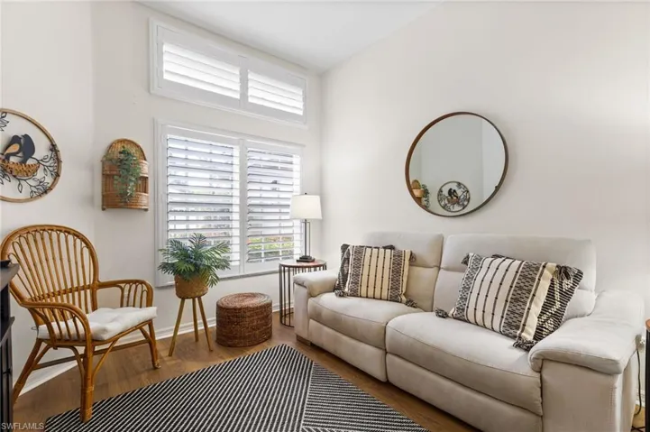 Living room with hardwood / wood-style flooring