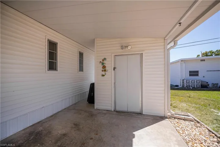 Property entrance with a patio