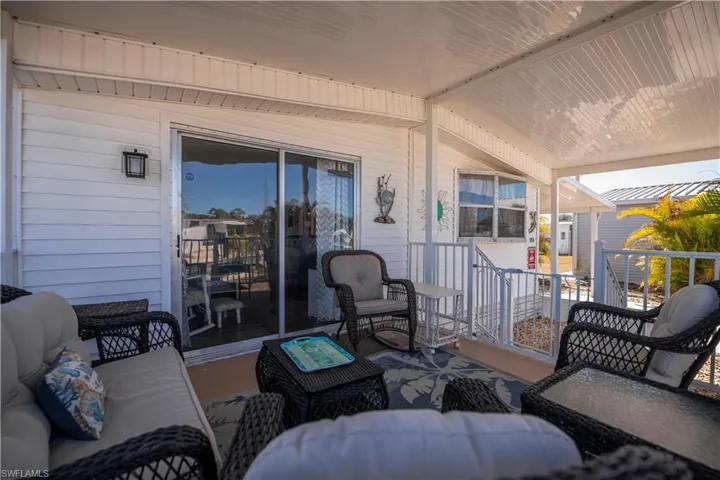 Covered porch with outdoor furniture