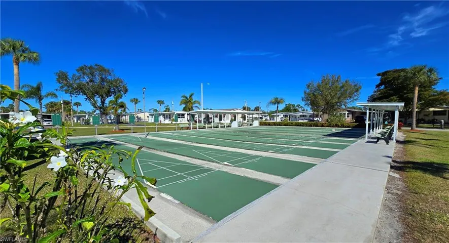 Surrounding community featuring shuffleboard and a residential view