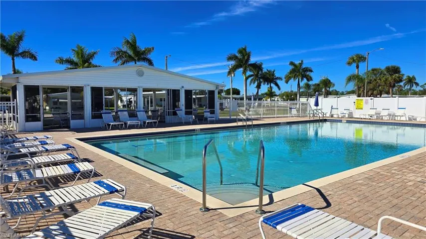 Community pool featuring a patio
