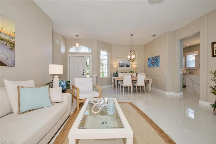 Living room with sink and a chandelier