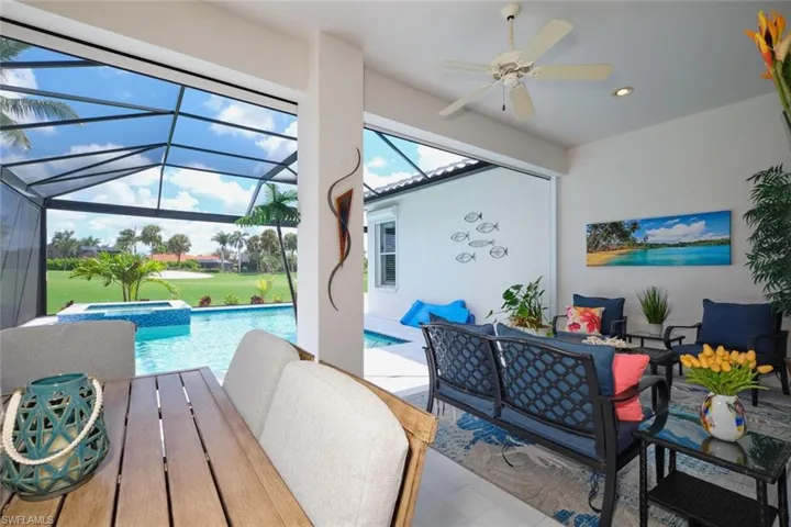 View of pool featuring ceiling fan