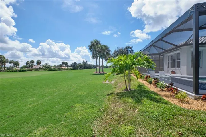 View of yard with glass enclosure