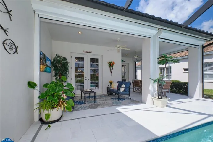 View of patio featuring ceiling fan and french doors