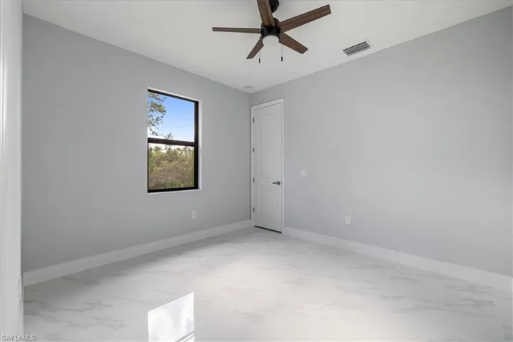 Spare room featuring ceiling fan