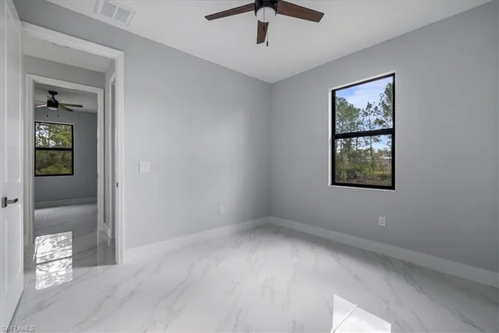 Unfurnished room with ceiling fan