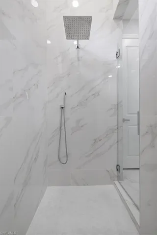 Bathroom with a shower with shower door