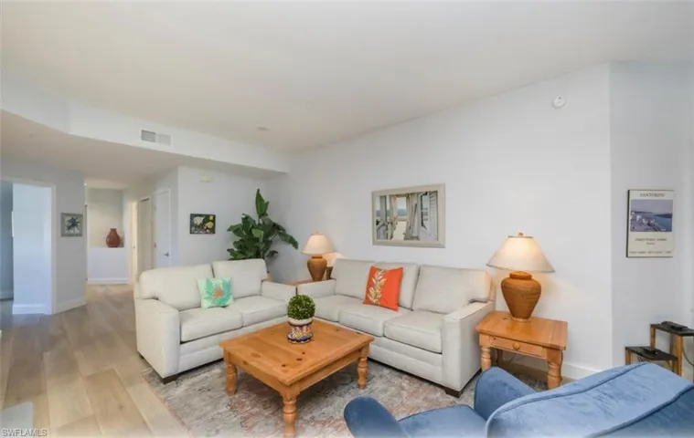Living room with wood finished floors and baseboards