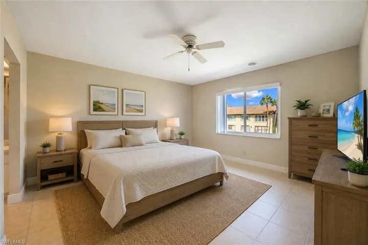 Tiled flooring, ceiling fan, and a wide window with exterior exposure