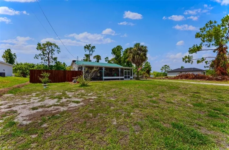 View of yard featuring a sunroom